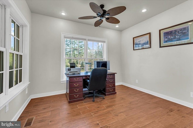 office featuring recessed lighting, visible vents, baseboards, and wood finished floors