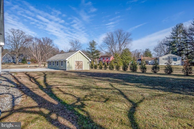 view of yard with an outbuilding and a storage shed