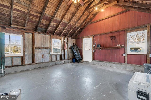 misc room featuring wood ceiling, concrete floors, and high vaulted ceiling