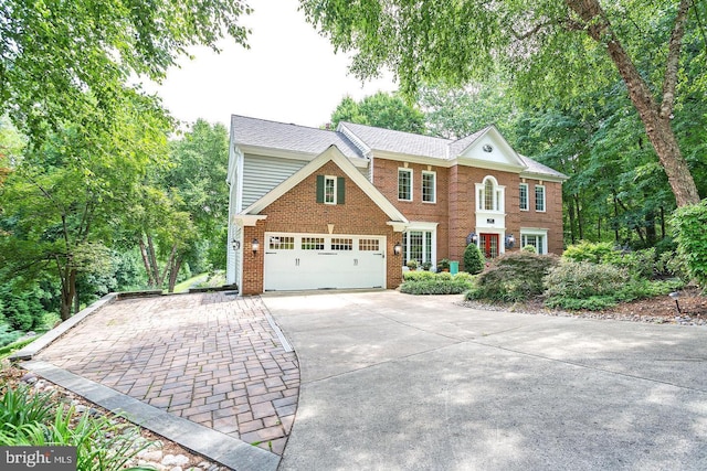 11905 Champion Lake Ct, Herndon, VA 20170 - view of front of property featuring concrete driveway, brick siding, and a garage