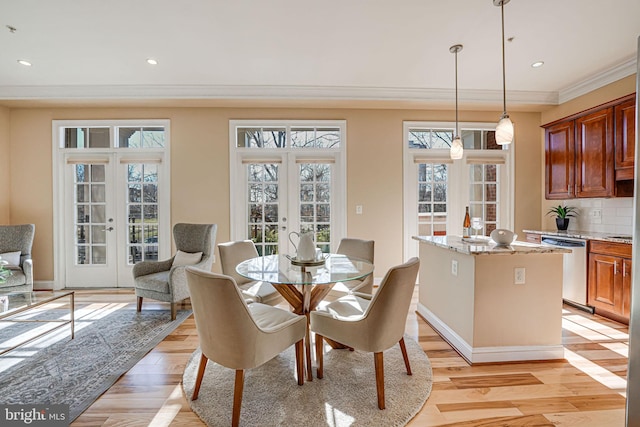 dining room with light wood-style flooring, recessed lighting, french doors, crown molding, and baseboards