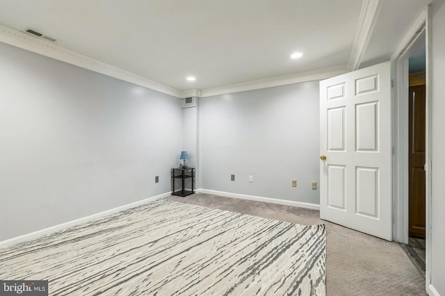 empty room with visible vents, crown molding, baseboards, light colored carpet, and recessed lighting