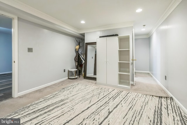 spare room featuring recessed lighting, baseboards, carpet floors, and ornamental molding