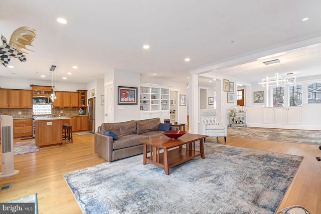 living area featuring recessed lighting and light wood-type flooring