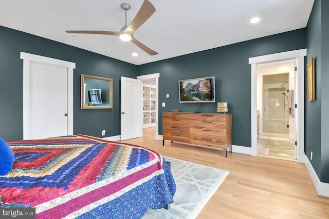 bedroom with baseboards, recessed lighting, wood finished floors, ensuite bath, and a ceiling fan