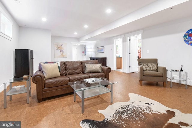 living room with recessed lighting and baseboards