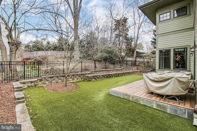 view of yard featuring a deck and a fenced backyard