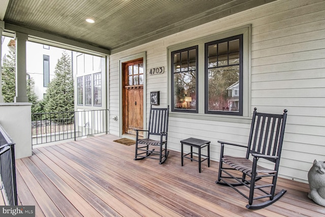 wooden deck featuring covered porch