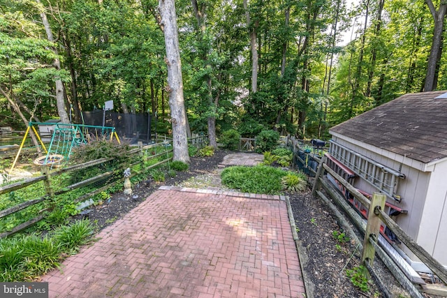 24 W Orange Ct, Baltimore, MD 21234 - fenced backyard with a patio area
