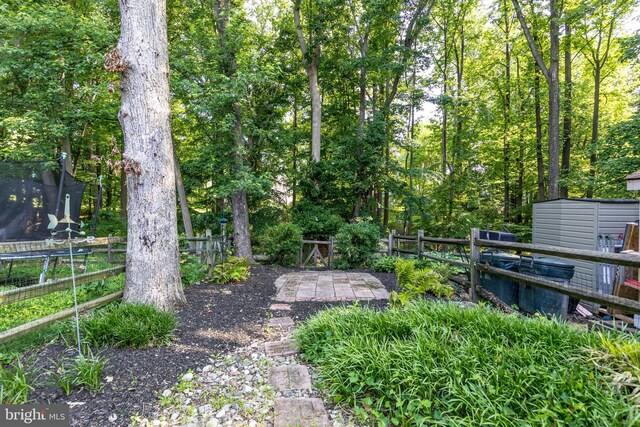24 W Orange Ct, Baltimore, MD 21234 - view of yard with a trampoline