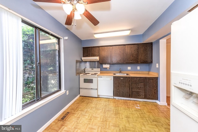 24 W Orange Ct, Baltimore, MD 21234 - kitchen featuring white appliances, a sink, under cabinet range hood, dark brown cabinets, and light countertops