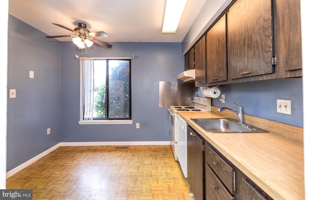 24 W Orange Ct, Baltimore, MD 21234 - kitchen with a sink, under cabinet range hood, light countertops, ceiling fan, and baseboards