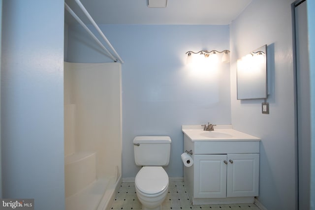 24 W Orange Ct, Baltimore, MD 21234 - bathroom featuring vanity, a shower, toilet, baseboards, and tile patterned floors