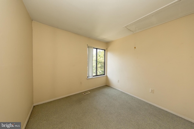 24 W Orange Ct, Baltimore, MD 21234 - carpeted empty room featuring attic access and baseboards