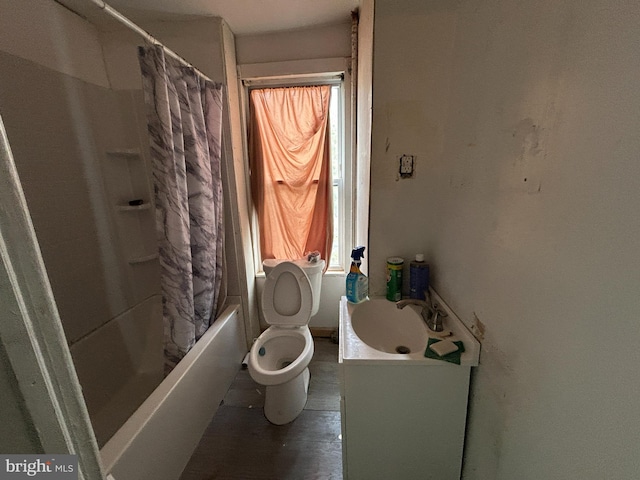 bathroom featuring vanity, toilet, and shower / bath combo with shower curtain