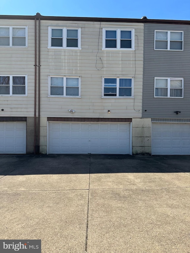 back of house with a garage