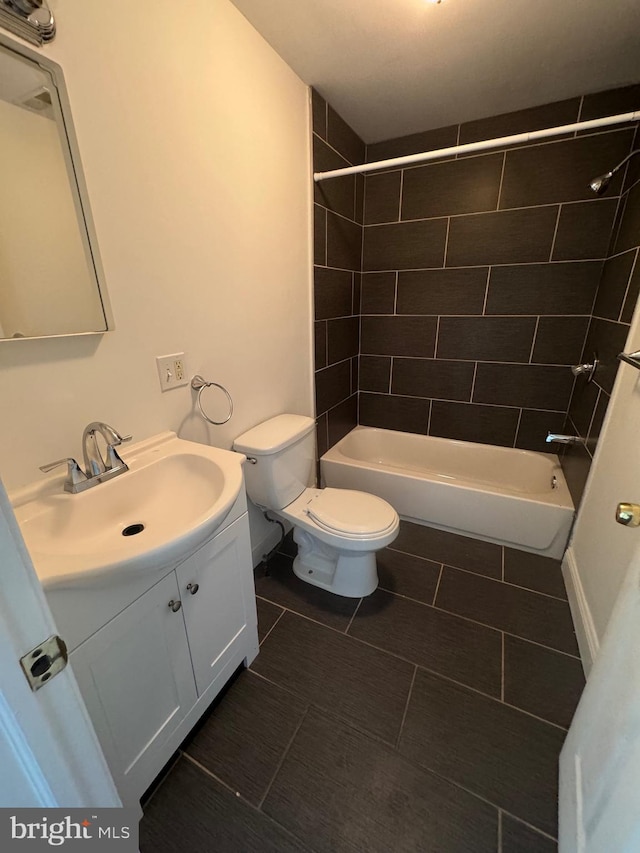 full bathroom featuring toilet, vanity, and shower / bathing tub combination