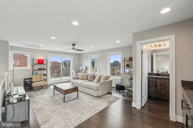 living area featuring a ceiling fan, recessed lighting, dark wood-style floors, and baseboards