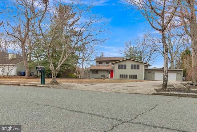 99 N Lakeshore, Manahawkin, NJ 08050 - view of front of home with stucco siding, concrete driveway, and an attached garage
