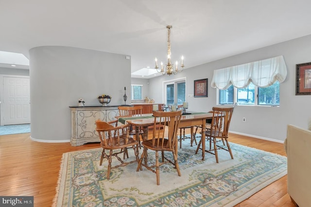 99 N Lakeshore, Manahawkin, NJ 08050 - dining space featuring light wood-type flooring, baseboards, and a notable chandelier