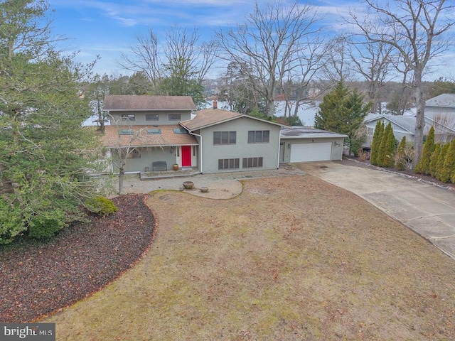 99 N Lakeshore, Manahawkin, NJ 08050 - view of front of house featuring stucco siding, driveway, and an attached garage