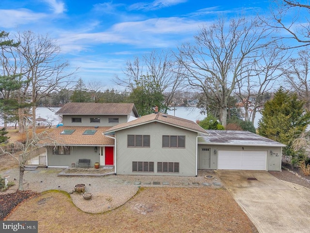 99 N Lakeshore, Manahawkin, NJ 08050 - view of front of house with concrete driveway and an attached garage