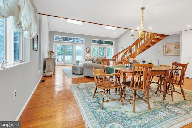 99 N Lakeshore, Manahawkin, NJ 08050 - dining space featuring stairs, light wood-style flooring, a notable chandelier, and baseboards