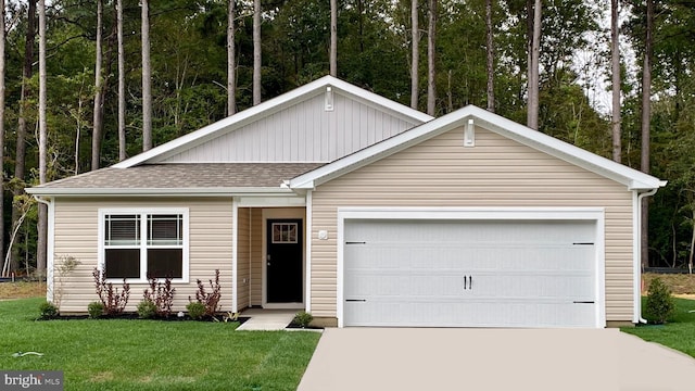 ranch-style home featuring an attached garage, a shingled roof, driveway, and a front lawn