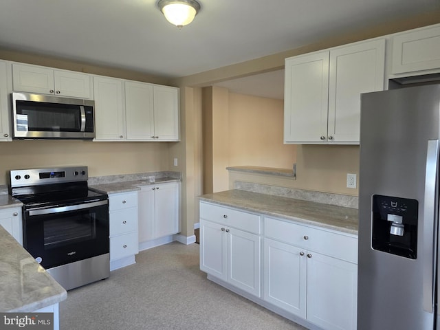 kitchen featuring white cabinetry and stainless steel appliances