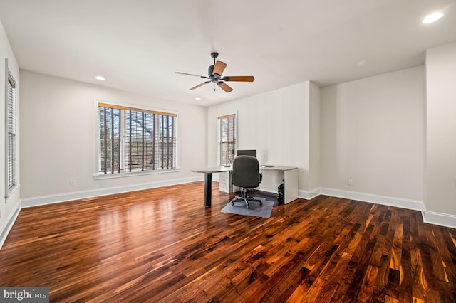 unfurnished office with recessed lighting, baseboards, and wood finished floors