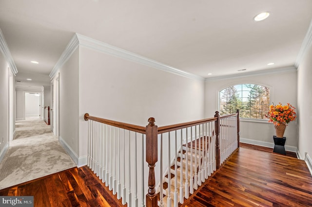 hallway featuring an upstairs landing, wood finished floors, recessed lighting, crown molding, and baseboards