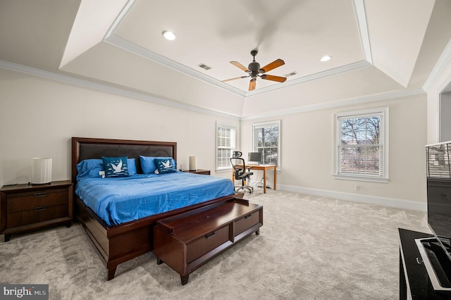 carpeted bedroom with visible vents, a raised ceiling, baseboards, and ornamental molding