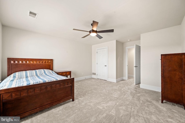 bedroom featuring visible vents, baseboards, carpet, and a ceiling fan