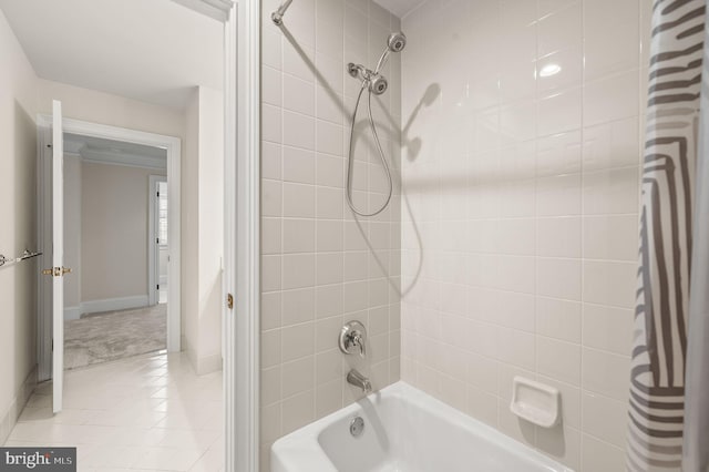 full bath with tile patterned floors, baseboards, and shower / tub combo