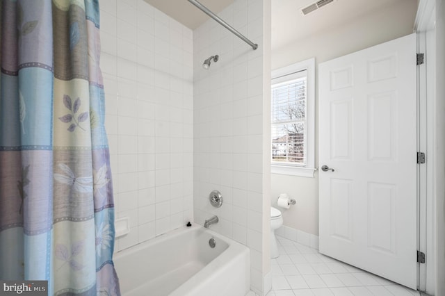 bathroom with visible vents, baseboards, toilet, shower / bath combo with shower curtain, and tile patterned floors