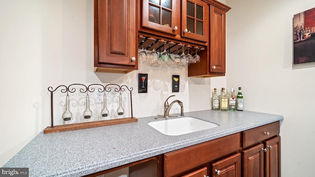 interior space featuring a sink and indoor wet bar