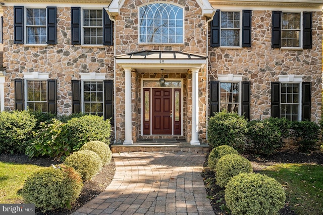 doorway to property featuring a standing seam roof