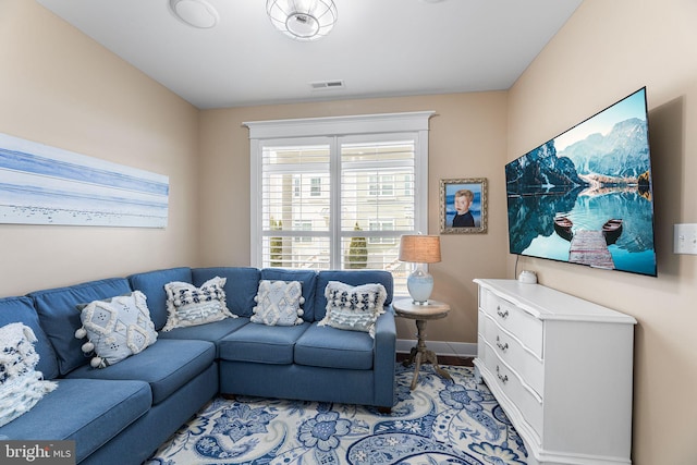 living room featuring visible vents and baseboards