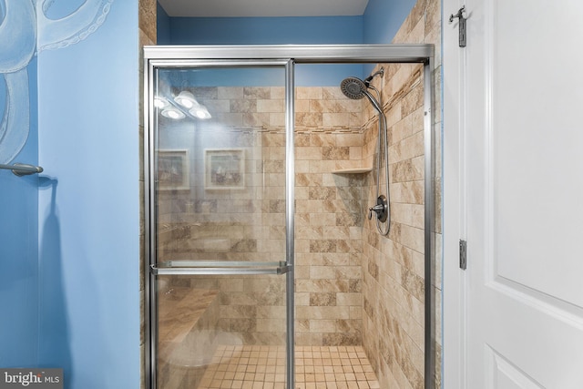 full bath featuring a shower stall