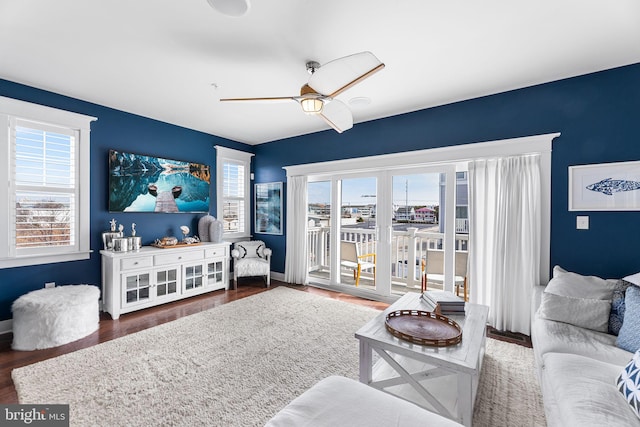 living room featuring wood finished floors and a ceiling fan