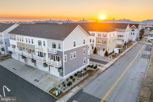 aerial view at dusk with a residential view