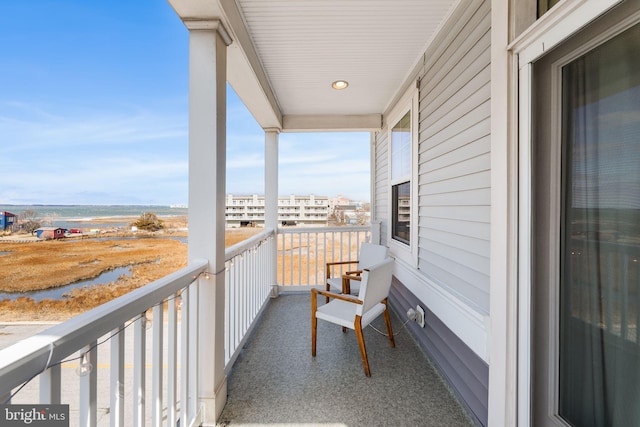 balcony featuring a water view