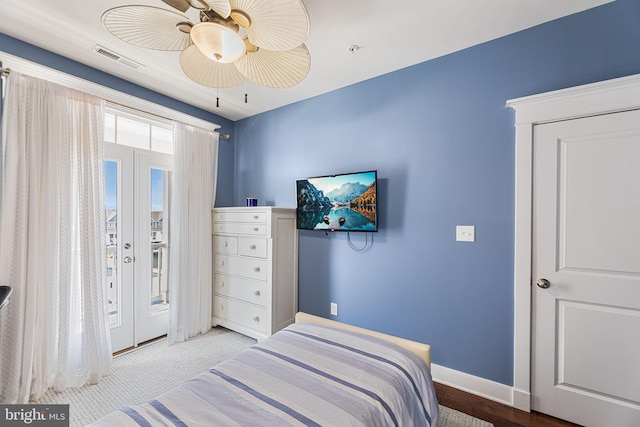 bedroom with visible vents, baseboards, ceiling fan, and access to outside