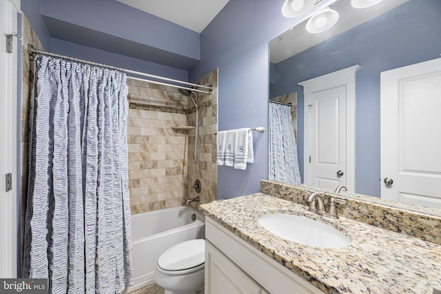 bathroom with shower / tub combo, toilet, and vanity