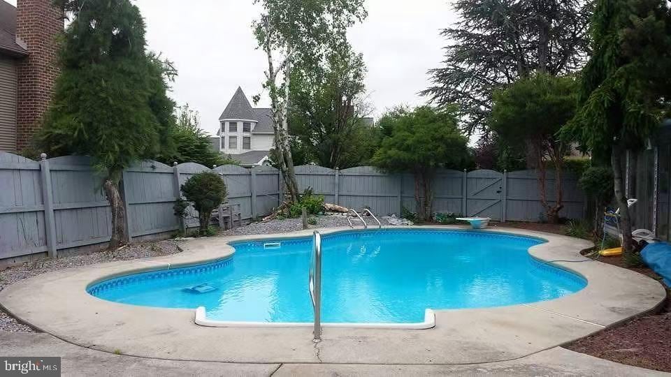 view of pool featuring a fenced backyard and a fenced in pool