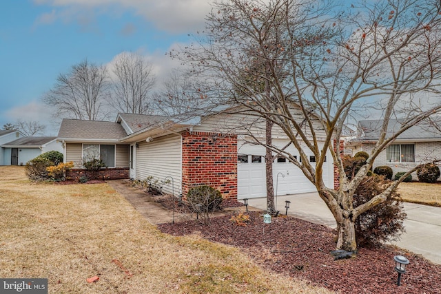 view of property exterior featuring brick siding, a lawn, an attached garage, and concrete driveway