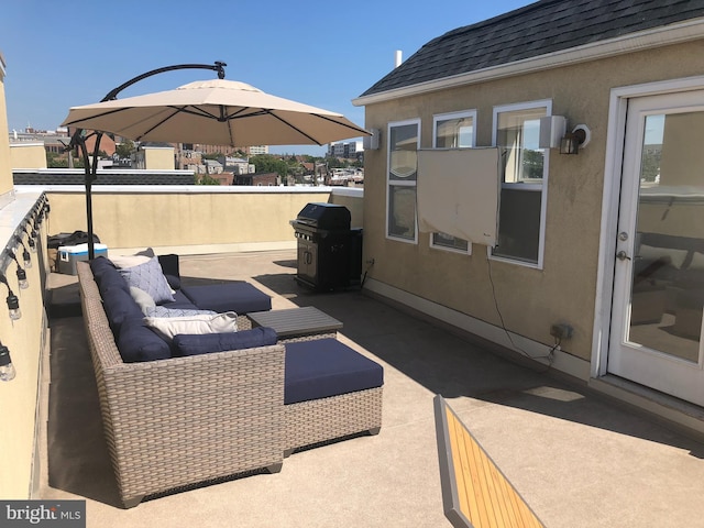 view of patio with grilling area and outdoor lounge area