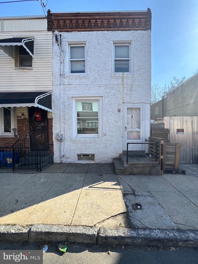 view of property featuring fence