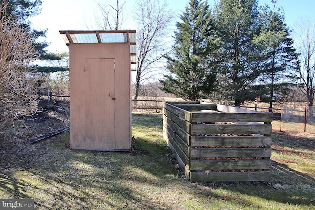 view of outdoor structure featuring fence