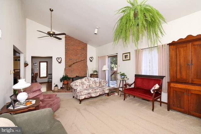 living area featuring a ceiling fan, a fireplace, light colored carpet, and a healthy amount of sunlight